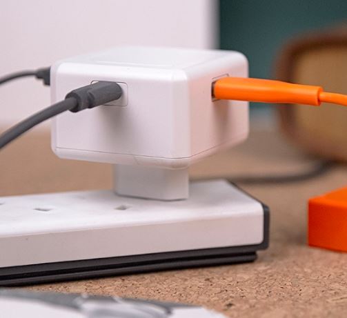 USB-Cube Power 60W USB-PD charger featuring multiple ports for fast and efficient power delivery. Compact design ideal for home or travel use.